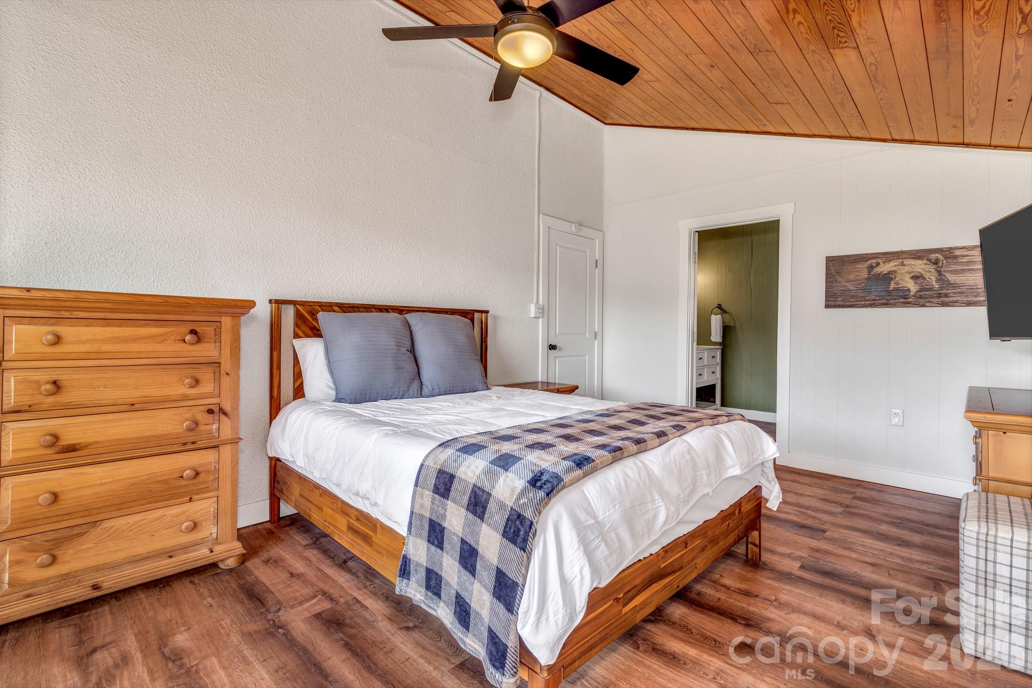 80 Hidden Falls Road Maggie Valley, NC 28751 - Photo 39 of 47 a bedroom with a bed and dresser