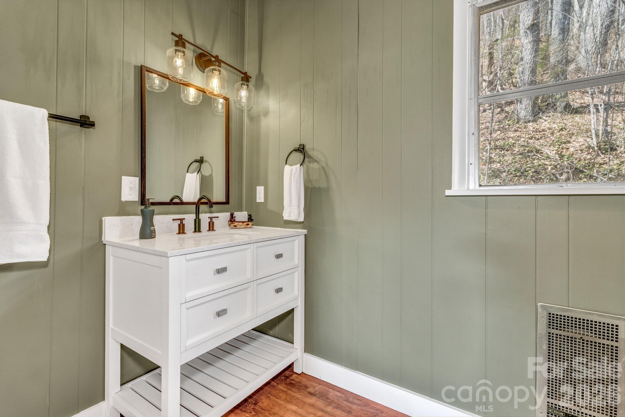 80 Hidden Falls Road Maggie Valley, NC 28751 - Photo 41 of 47 a bathroom with a double vanity sink mirror and