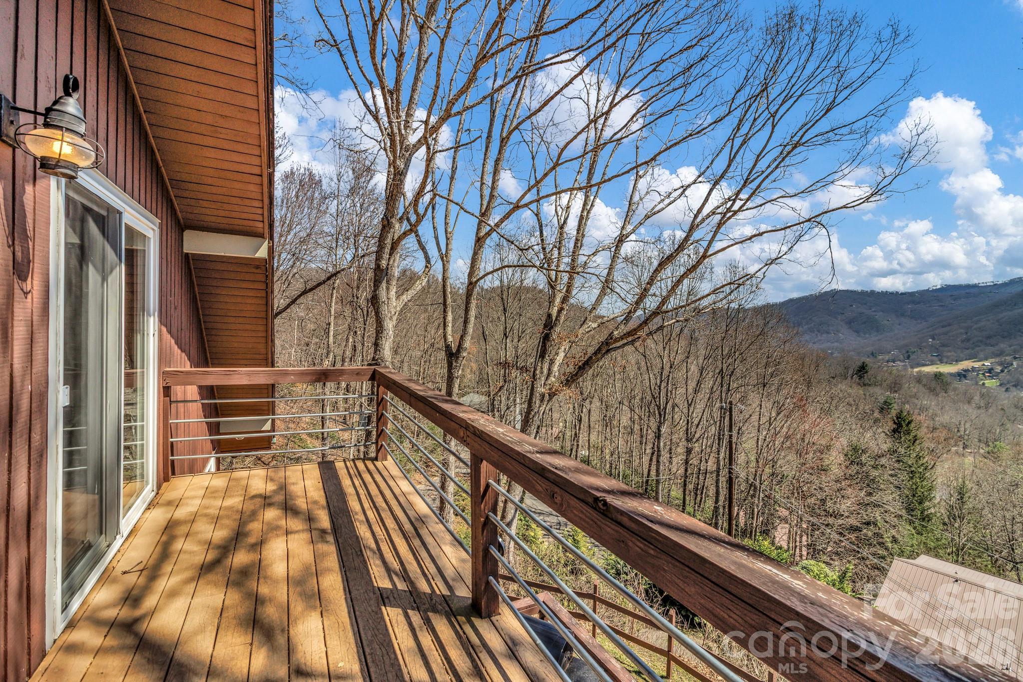 80 Hidden Falls Road Maggie Valley, NC 28751 - Photo 42 of 47 a view of balcony with wooden floor and fence