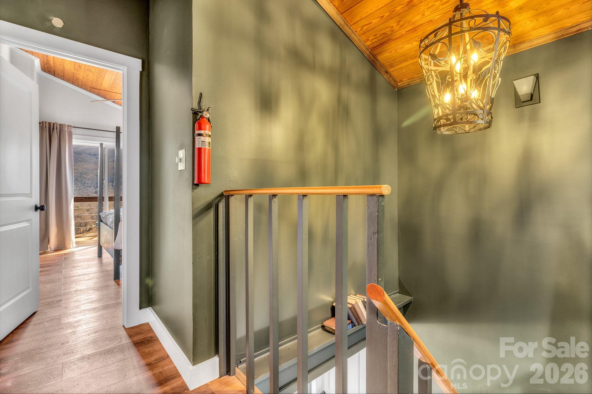 80 Hidden Falls Road Maggie Valley, NC 28751 - Photo 45 of 47 a view of a hallway with chandelier