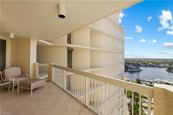 a view of a balcony with chairs