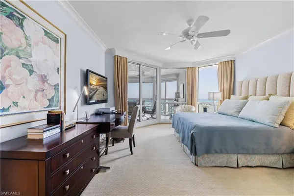 a spacious bedroom with a bed and window