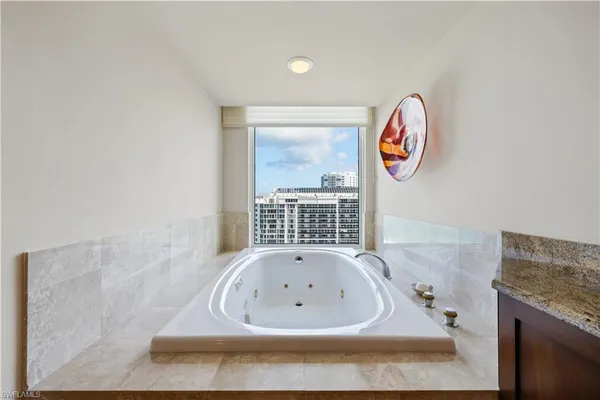 a bathroom with a bathtub and a sink