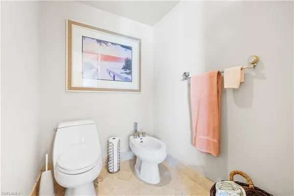 a bathroom with a granite countertop sink mirror and double