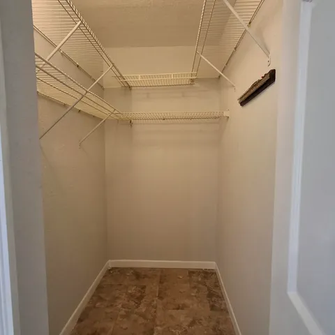 a view of a room with racks on the wall