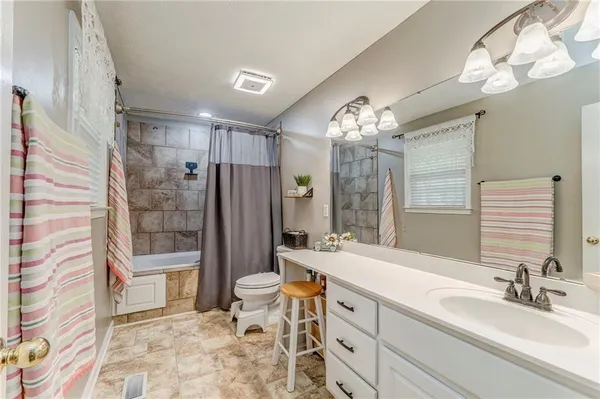 a bedroom with a bed and a desk