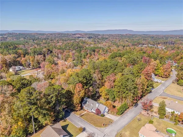 an aerial view of residential houses with outdoor space