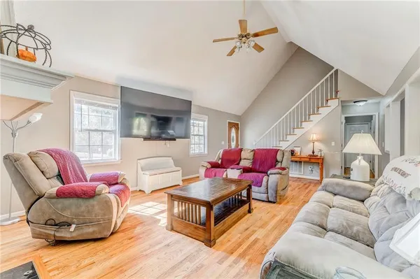 a living room with furniture and a flat screen tv