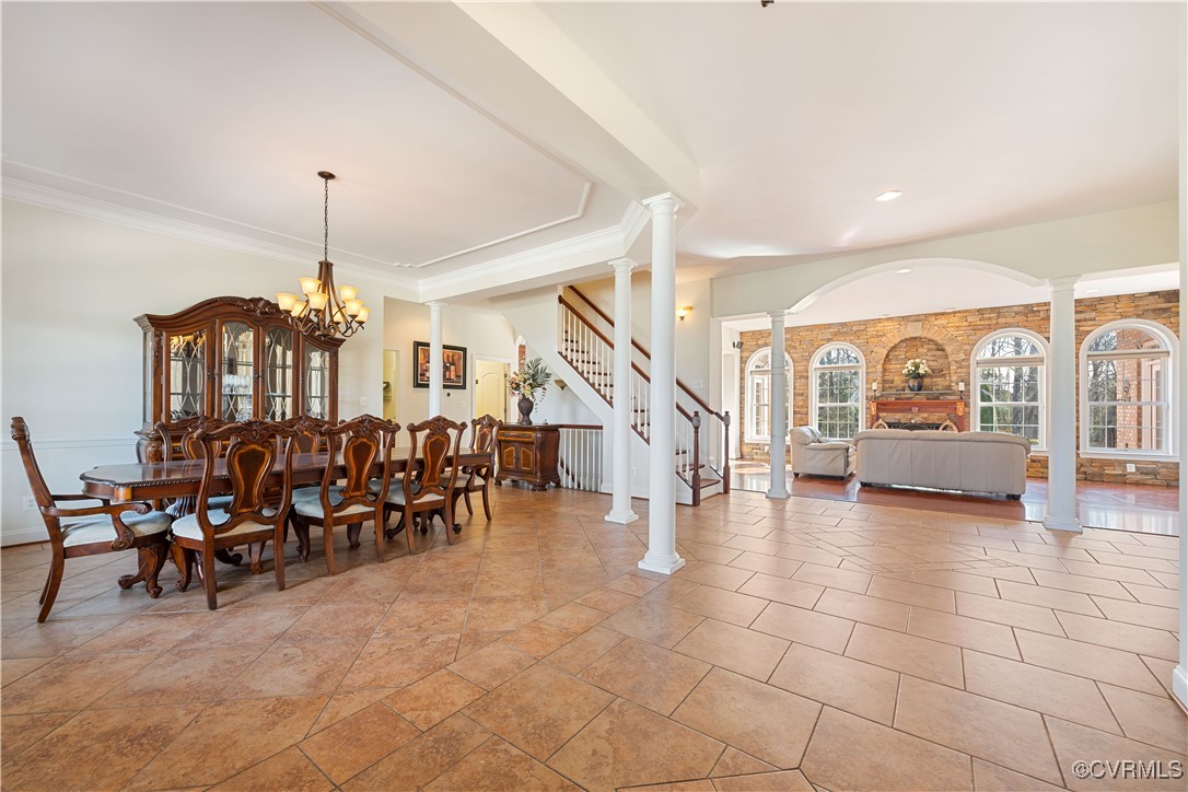 18185 Narrow Path Trail Doswell, VA 23047 - Photo 12 of 48 a living room with lots of furniture a chandelier and a dining table