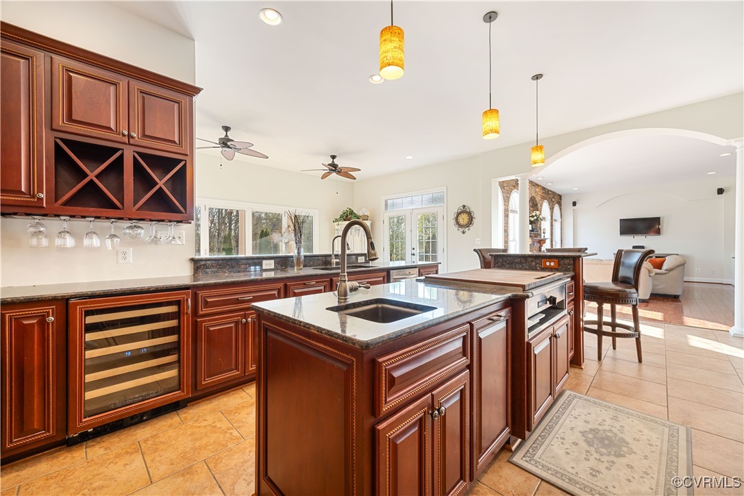 18185 Narrow Path Trail Doswell, VA 23047 - Photo 17 of 48 a kitchen that has a sink a stove and a table with chairs