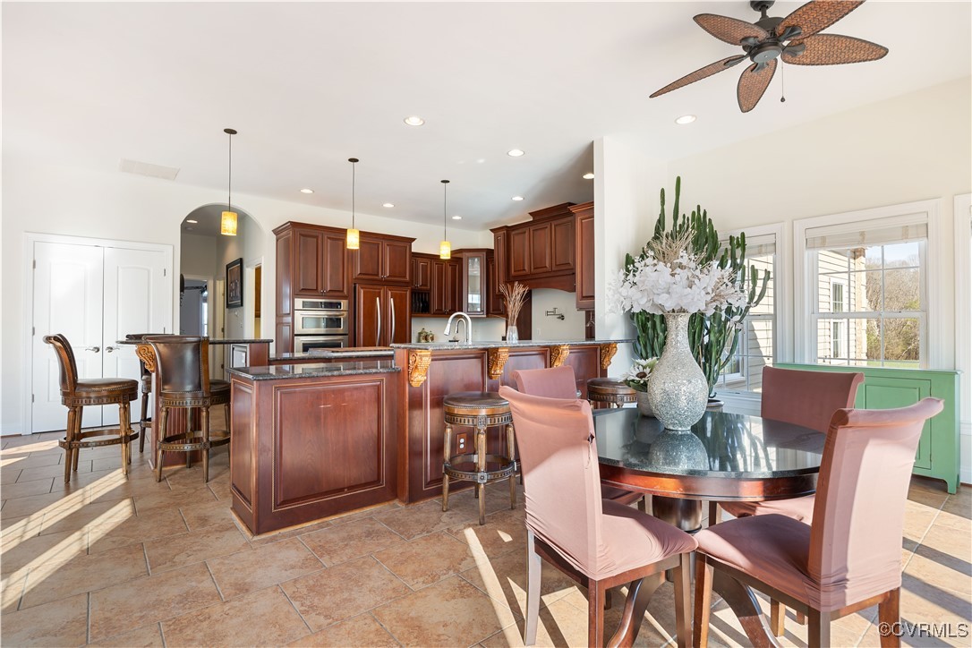 18185 Narrow Path Trail Doswell, VA 23047 - Photo 20 of 48 a dining room filled with furniture and kitchen view