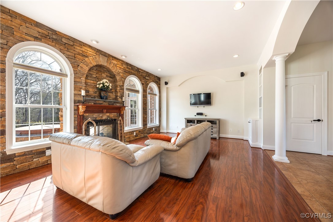 18185 Narrow Path Trail Doswell, VA 23047 - Photo 23 of 48 a living room with furniture a fireplace and a large window