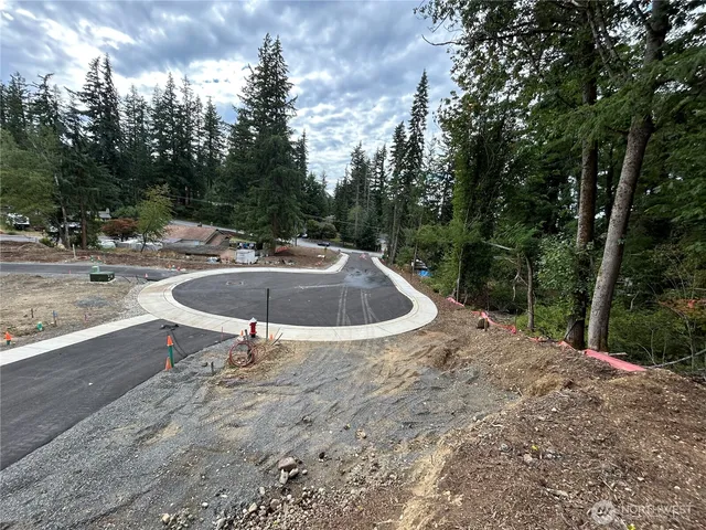 a swimming pool with outdoor seating and yard