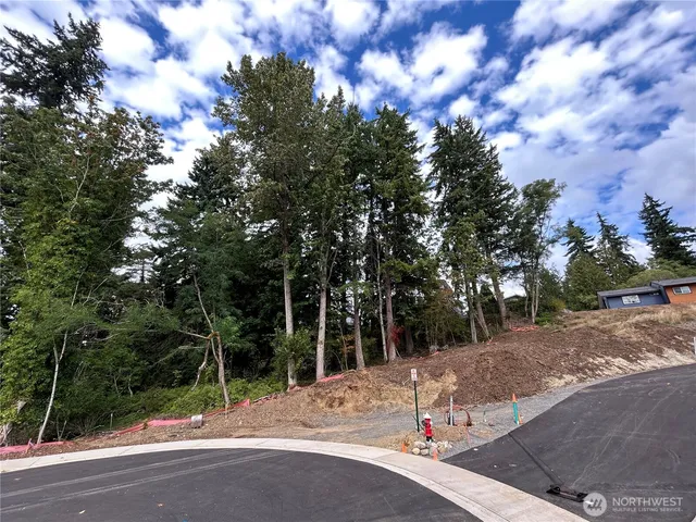 a view of a yard with iron fence