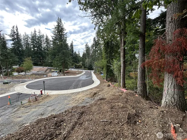 a view of a backyard with swimming pool