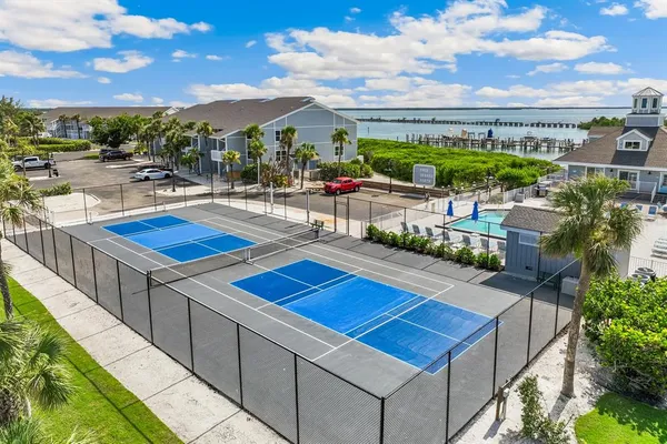 a view of a patio with couches table and chairs and potted plants