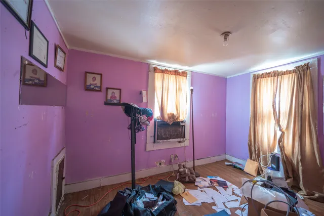 a room with a bed and a window