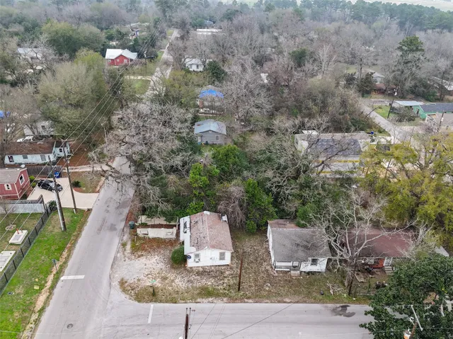 an aerial view of house with yard