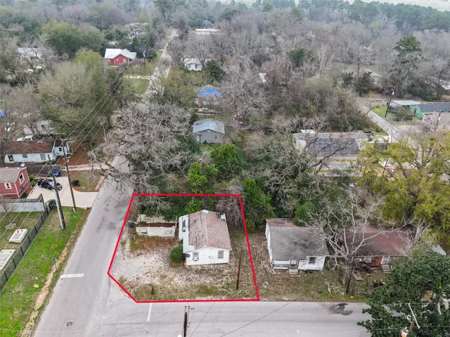 an aerial view of a house with outdoor space