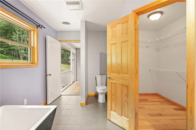 a bathroom with a tub and shower