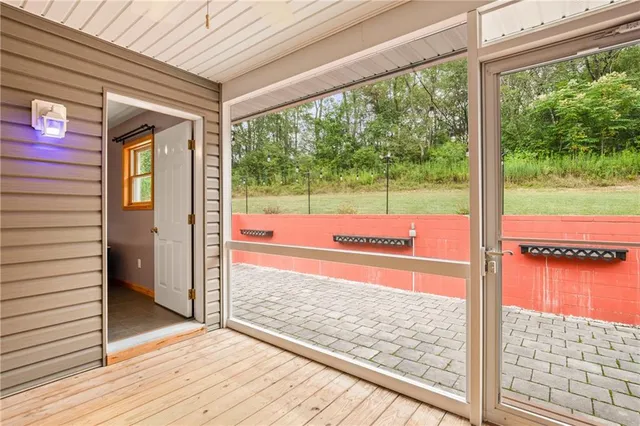 a view of a porch and wooden floor