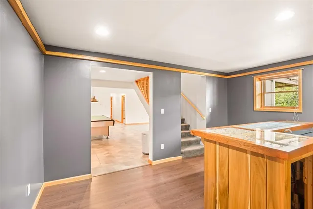 a view of a room that has a bed and a window