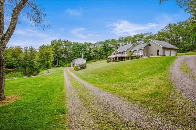 a view of a house with a yard