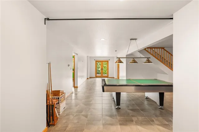 a view of a hallway with seating area