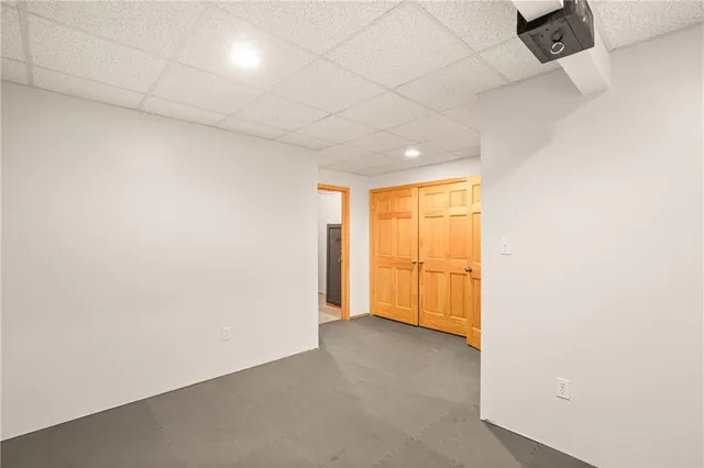 an empty room with a empty space and a window