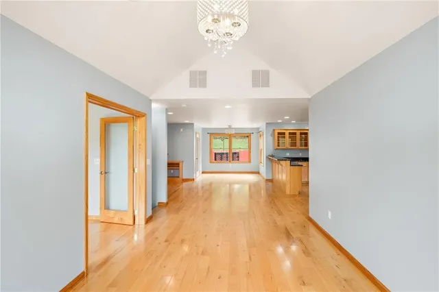 a view of an entryway with wooden floor