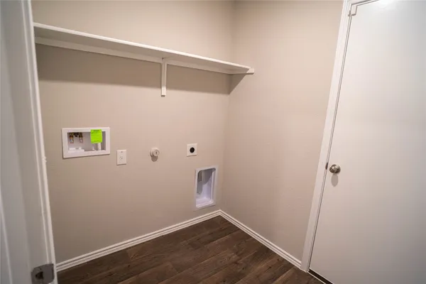 a view of a room with wooden walls