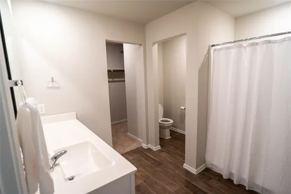 a bathroom with a sink a mirror and a vanity
