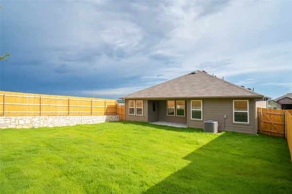 a view of yard with swimming pool and trees