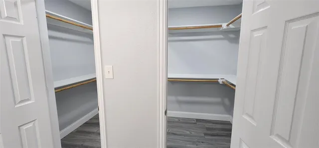 a bathroom with a shower and a glass door