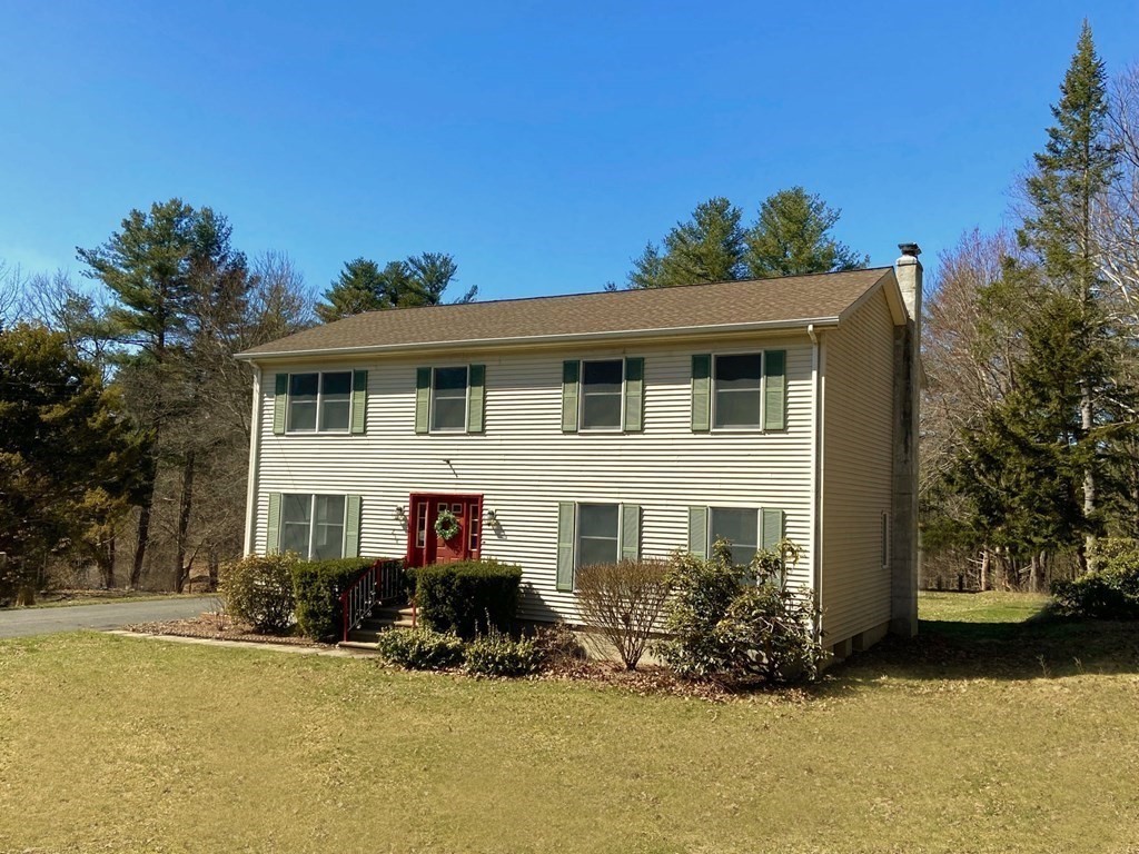258 Old Warren Road Palmer, MA 01069 - Photo 1 of 24 a front view of a house with a yard