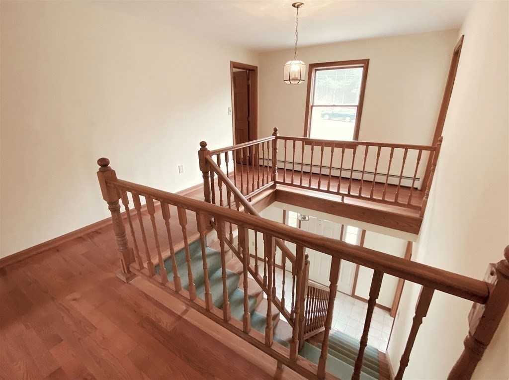 258 Old Warren Road Palmer, MA 01069 - Photo 11 of 24 a view of staircase with railing and a rug