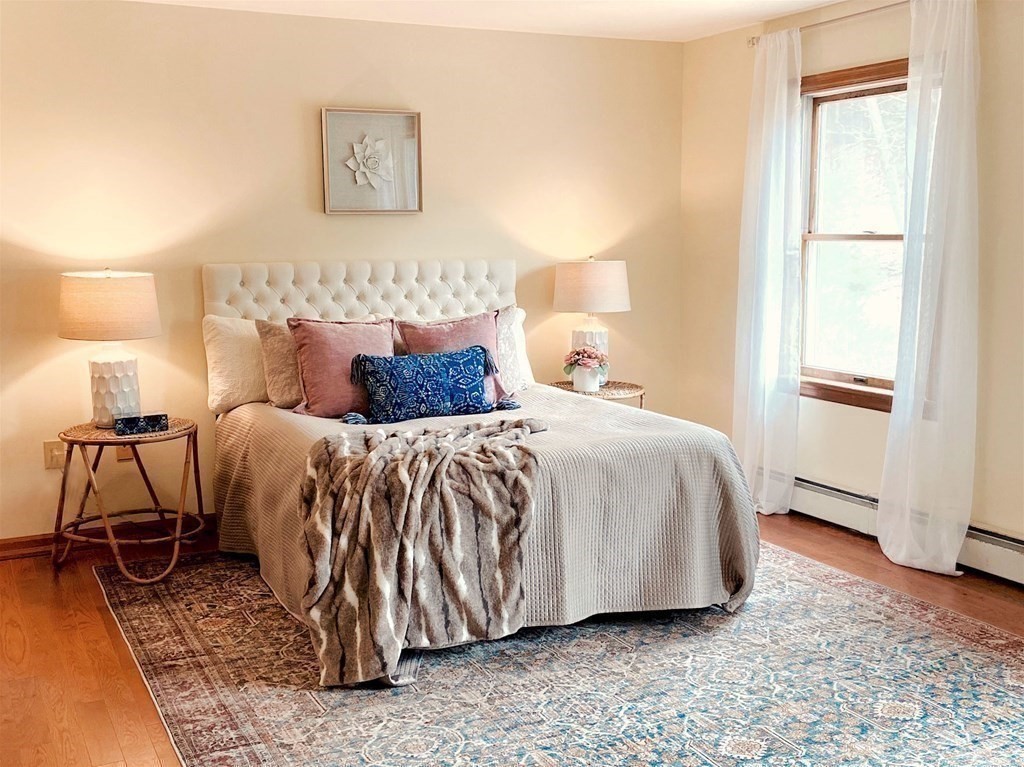 258 Old Warren Road Palmer, MA 01069 - Photo 12 of 24 a spacious bedroom with a bed and a window