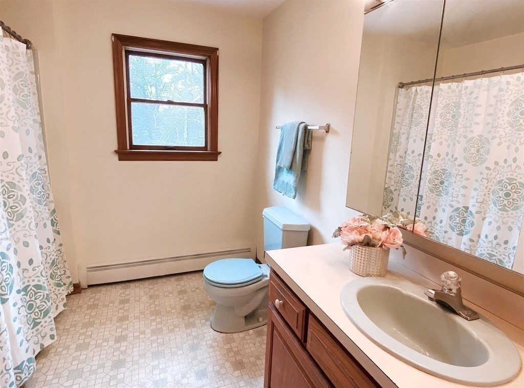 258 Old Warren Road Palmer, MA 01069 - Photo 16 of 24 a bathroom with a sink and a mirror