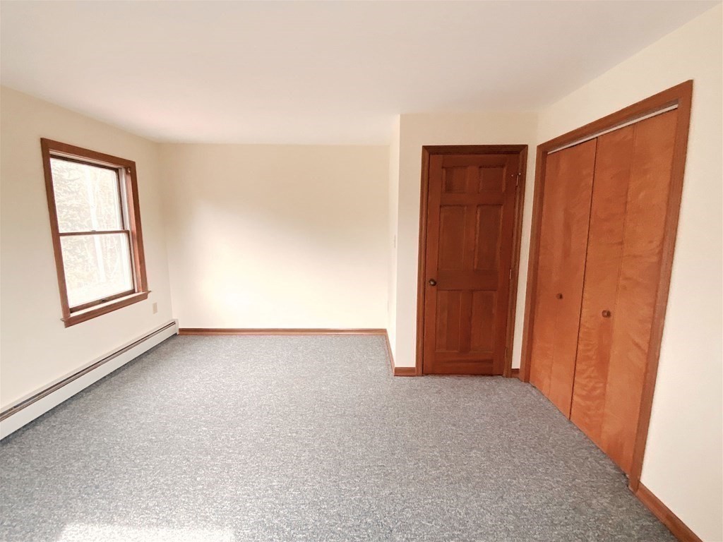 258 Old Warren Road Palmer, MA 01069 - Photo 18 of 24 an empty room with windows and closet