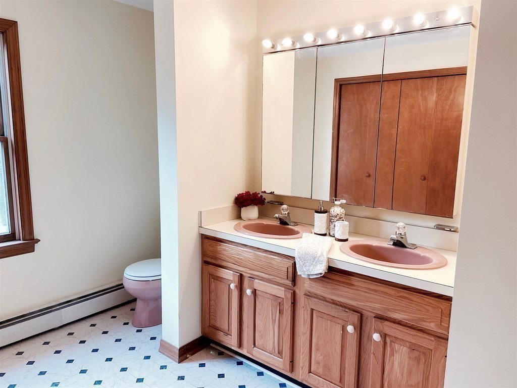 258 Old Warren Road Palmer, MA 01069 - Photo 19 of 24 a bathroom with a sink a toilet and shower