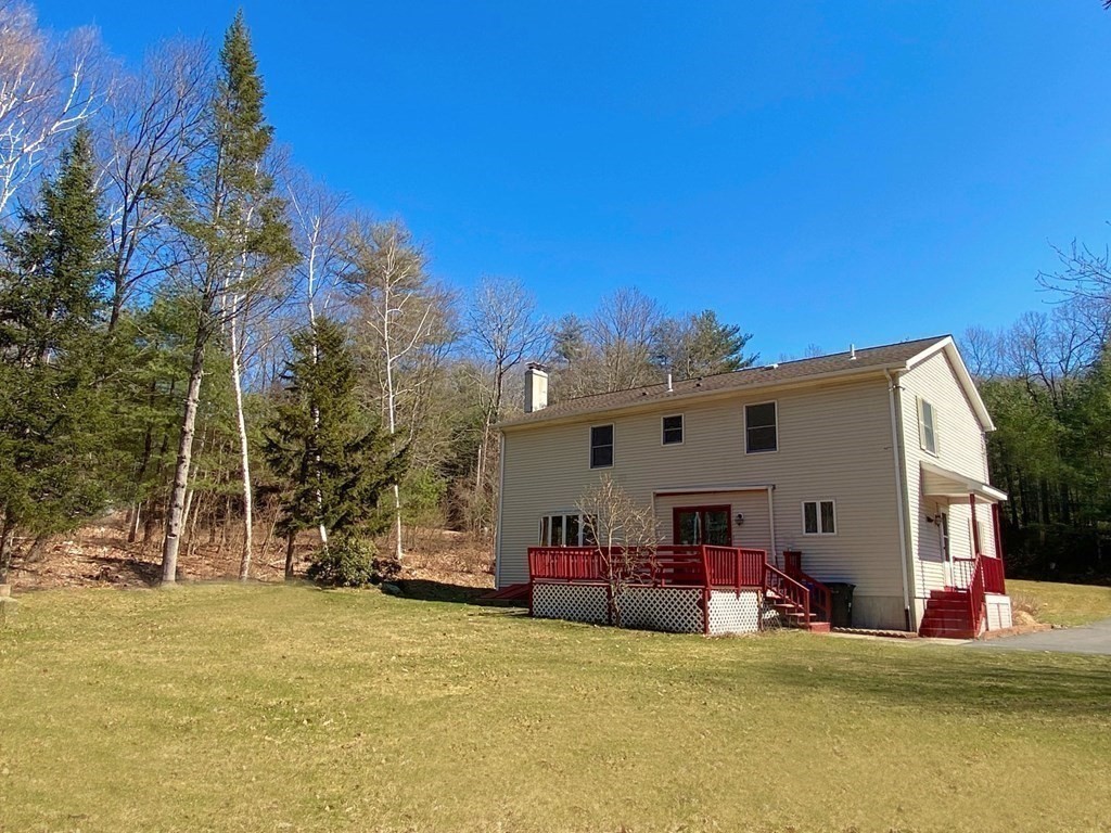 258 Old Warren Road Palmer, MA 01069 - Photo 22 of 24 a view of a house with backyard and sitting area