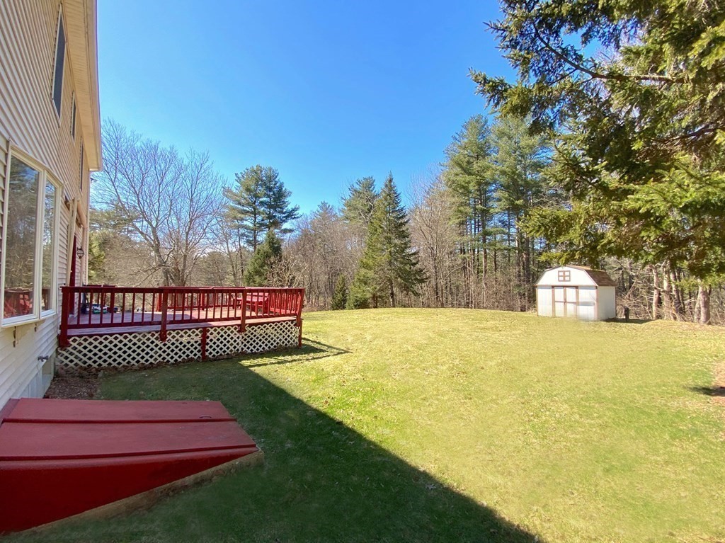 258 Old Warren Road Palmer, MA 01069 - Photo 23 of 24 a view of a deck with a yard