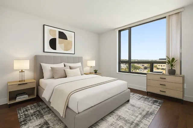 a large white bed in a white room