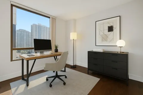 a view of a workspace with furniture