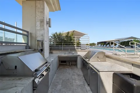a view of a kitchen with a sink and stove