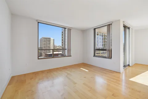 a view of an empty room with windows