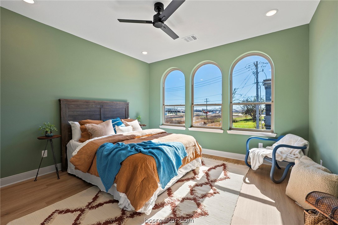 106 33rd Street West Bryan, TX 77803 - Photo 13 of 22 a bedroom with a bed and ceiling windows