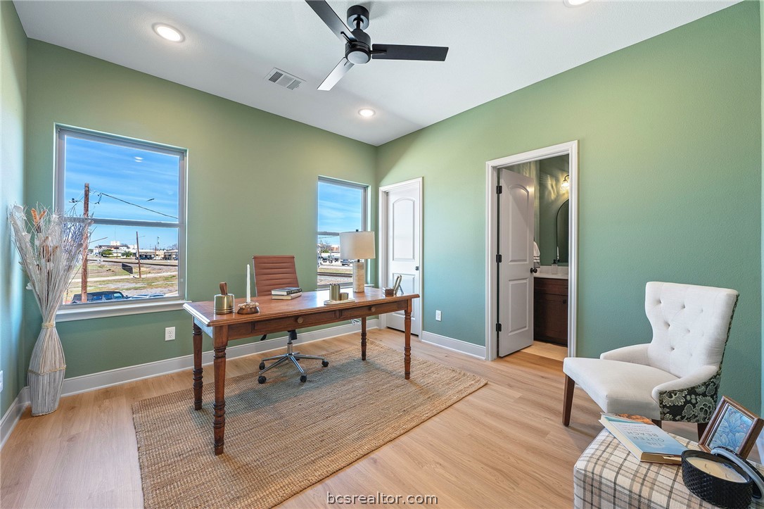 106 33rd Street West Bryan, TX 77803 - Photo 10 of 22 a work room with furniture and a wooden floor