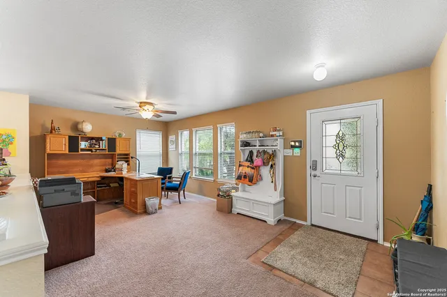 a view of a livingroom with furniture and window
