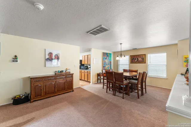 a view of a livingroom with furniture window and wooden floor